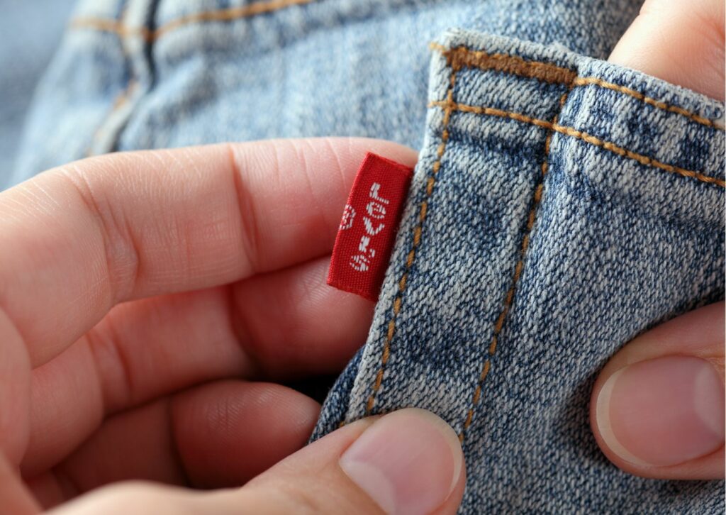 Orange seams on blue Levis jeans